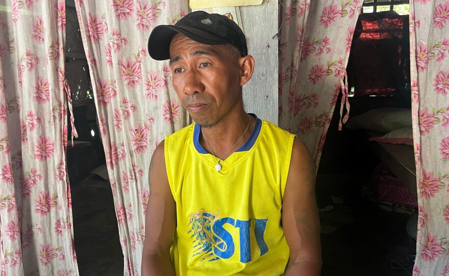 Fisherman Larry Hugo, 45, in his home on Thitu Island, which the Philippines calls Pag-asa.