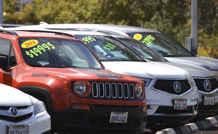 Used cars are displayed on the sales lot of a dealier in Corte Madera, Calif., on July 13. Used car prices have surged during the pandemic as many Americans have splurged on big-ticket items.