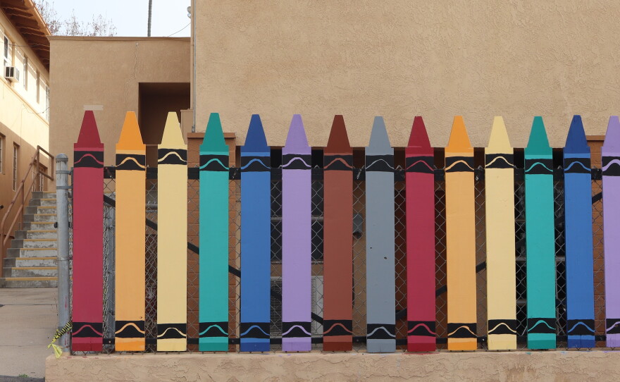 A crayon-shaped fence near a school playground at St. Katharine Drexel Academy in El Cerrito is shown on Dec. 31, 2024.