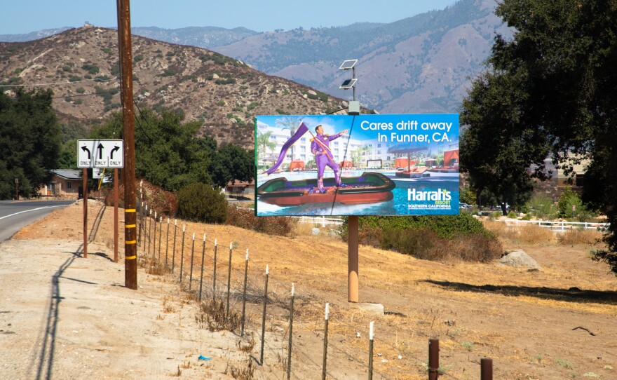 A sign for Harrah's Resort Southern California advertises for the casino along Valley Center Road, Sept. 3, 2020.