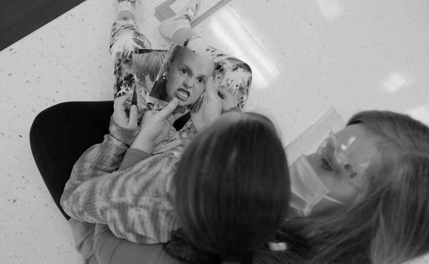 Peyton Wischmeier uses cards to help a child with autism identify her feelings using language on Jan. 18, 2020. The occupational and speech therapy room at WhidbeyHealth Medical Center was newly renovated in 2020 and remains open in 2022 because the services are financially viable.