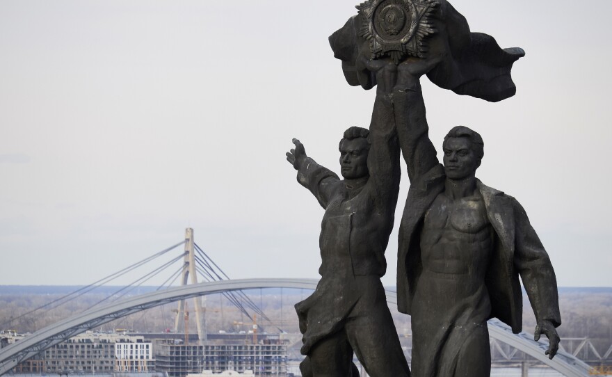 The statue under the People Friendship Arch in Kyiv, Ukraine, pictured on Feb. 23, 2022. It is being dismantled this week, but an altered version of the arch will remain standing.