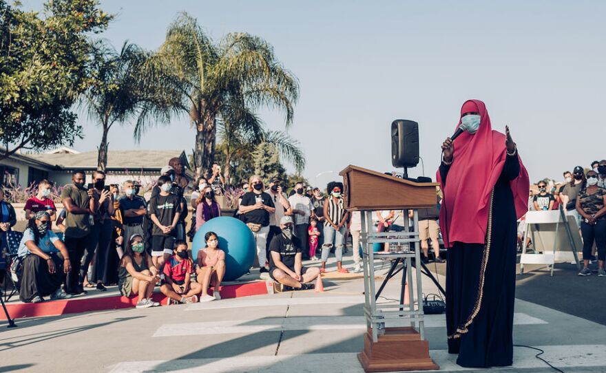 Ismahan Abdullahi, the executive director of the Muslim-American Society, speaks to the crowd during during a prayer vigil on Wednesday, June 3, 2020.