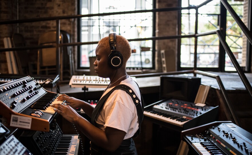 Tamko tries out keyboards at a music shop in Brooklyn. Tamko describes <em>Vagabon</em> as a flex: she plays many of the instruments you hear on it, and she learned the digital audio software Logic Pro so she could produce it almost entirely on her own.