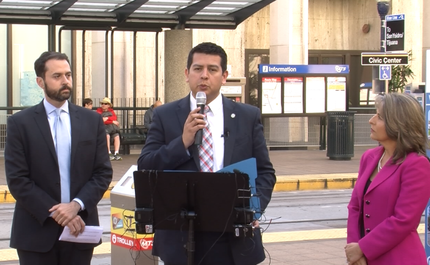 San Diego City Councilman David Alvarez speaks at a news conference calling on MTS to "fix the Compass Card," March 8, 2016. With him are Circulate San Diego Policy Counsel Colin Parent and Councilwoman Lori Zapf.