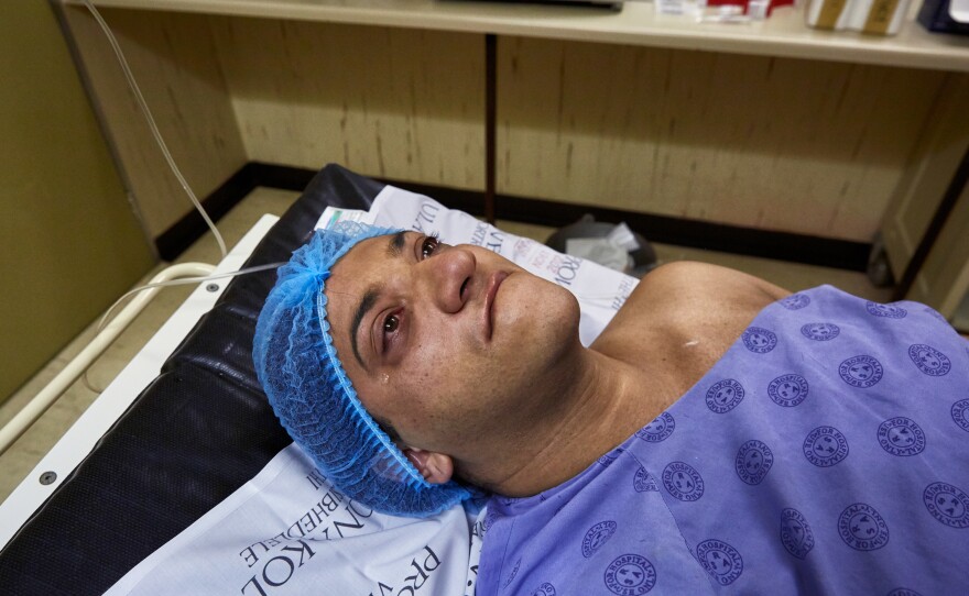 An emotional Chedino waits to be taken into the operating theater for her gender-affirming surgeries at the Groote Schuur Hospital in Cape Town, South Africa, in 2017.