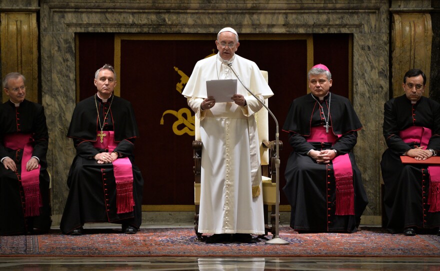 Pope Francis delivers his message during a meeting with cardinals and bishops of the Curia at the Vatican on Monday. The pope said the Curia suffered from "spiritual Alzheimer's"  and careerism.