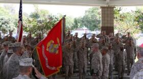 Brig. Gen. Daniel D. Yoo and Sgt. Maj. Douglas E. Berry salute the colors as the national anthem plays during I MEF (Fwd)'s reactivation ceremony at Camp Pendleton Oct. 23, 2013.


