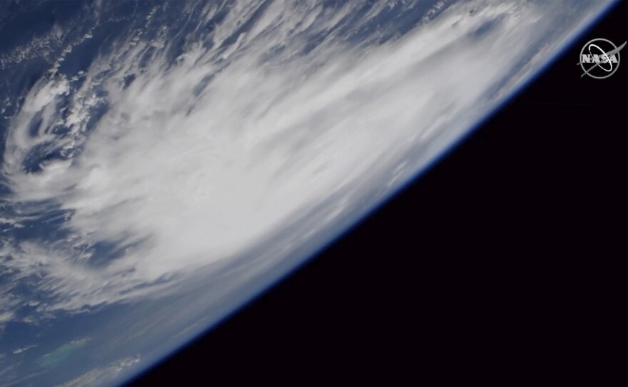 This Friday, Aug. 30, 2019, image provided by NASA shows a view of Hurricane Dorian from the International Space Station as it churned over the Atlantic Ocean.