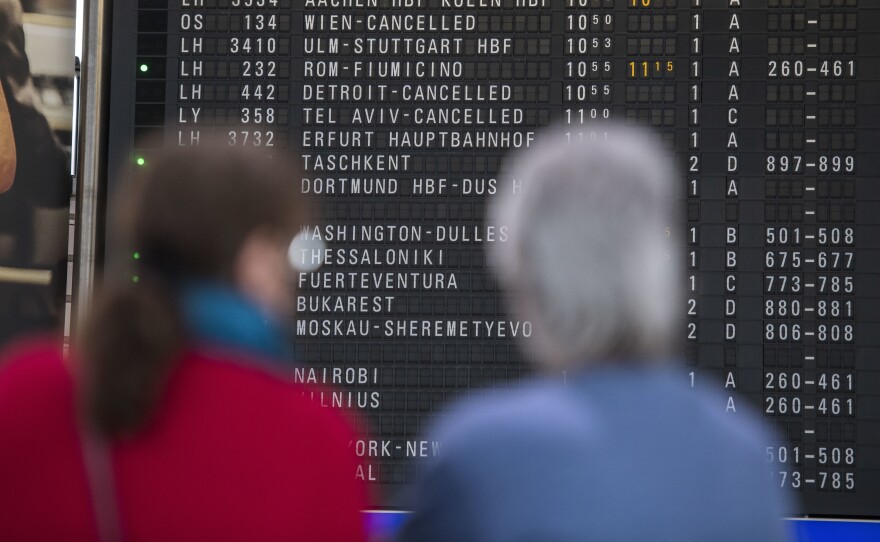 A destination board shows canceled flights at Frankfurt Airport in Germany last month. The coronavirus pandemic has disrupted travel plans for refugees who'd been granted asylum in various countries.