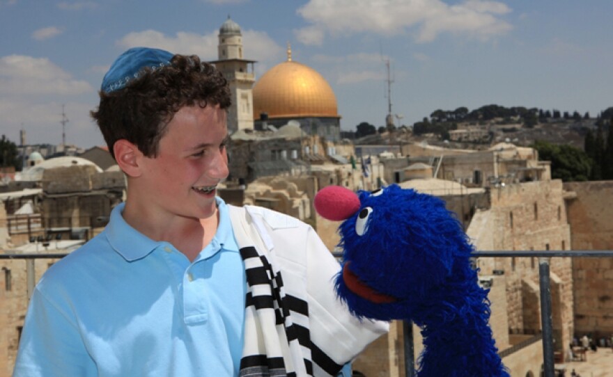 A young boy and Grover are in Israel, from SHALOM SESAME "It's Passover, Grover!"