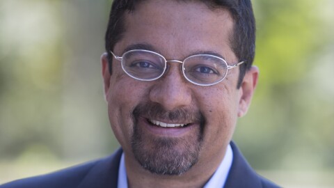 The image is an undated photograph of Shankar Vedantam, host of the "Hidden Brain" podcast.