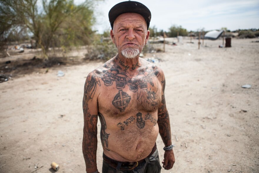 A Slab City resident poses for the camera, March 28, 2015. 