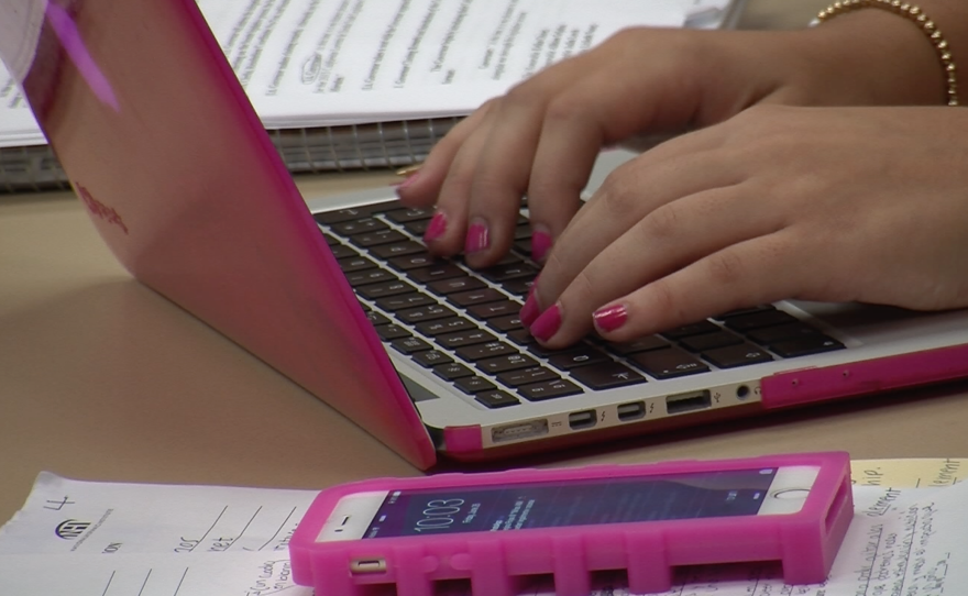 Lucia Regina Reyes Gonzalez, 16, types at her MacBook at the California Lorenzo de Zavala Youth Legislative Session, June 26, 2015.
