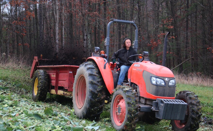 Pearl Wetherall, field manager at New Morning Farm, spreads manure.