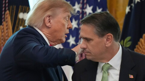 President Donald Trump walks past Attorney General Todd Blanche after speaking at a roundtable event in the East Room of the White House, Wednesday, Oct. 21, 2026, in Washington.