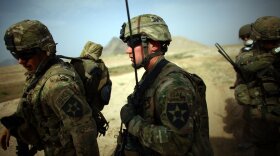 Capt. Chris Longto, of Joint Base Lewis-McChord Stryker brigade, heads out on patrol with Afghan soldiers in a rural area of Kandahar province, where the Taliban is still a threat.
