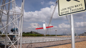 A drone, just returned from a delivery, swings into the landing mechanism in Muhanga, Rwanda. The country's government has contracted with American robotics company Zipline to deliver emergency blood through drones since 2016.