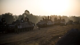 Israeli soldiers prepare weapons and vehicles in a deployment area as the conflict between Palestine and Gaza enters its seventh day on November 20, 2012 on Israel's border with the Gaza Strip. 
