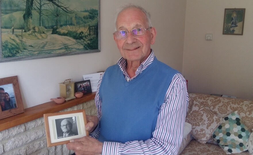 John Fieldsend, 84, with a photo he keeps on his fireplace mantel of Nicholas Winton, the man who saved his life. Fieldsend, born Hans Heini Feige, was one of 669 mostly Jewish children whom Winton rescued from Czechoslovakia just prior to World War II. For his efforts, Winton is called "Britain's Schindler." He died last year at 106.
