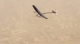 In this photo released by Solar Impulse, "Solar Impulse 2", a solar-powered airplane flies after taking off from Al Bateen Executive Airport in Abu Dhabi, United Arab Emirates, March 9, 2015.