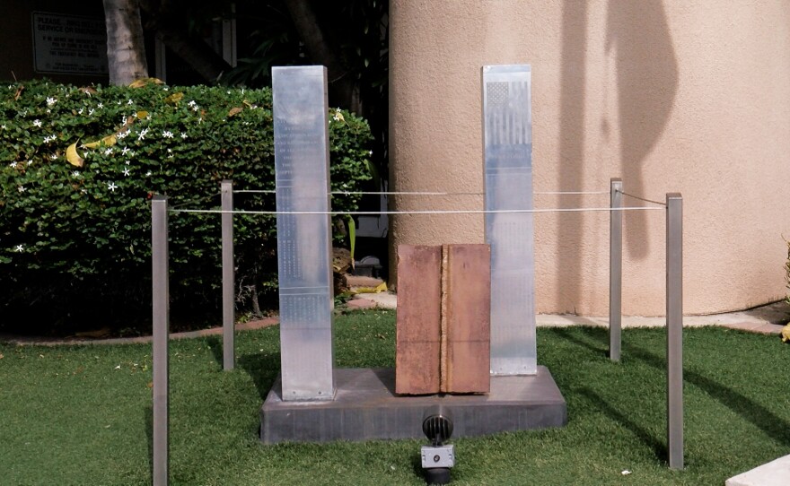 A memorial depicting the World Trade Center towers with a piece of steel from the actual towers in the middle is shown outside Fire Station 21 in Pacific Beach on September 2, 2021.