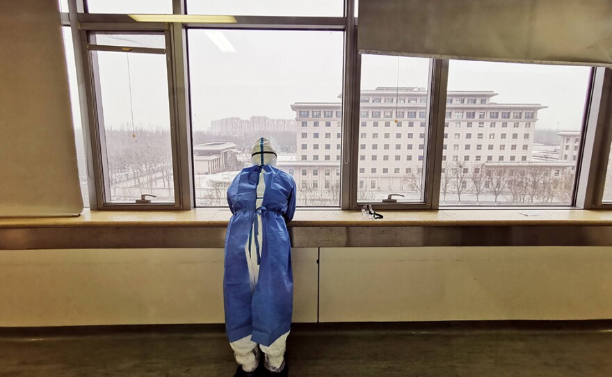 Frontline worker at window.