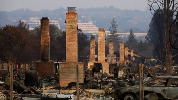 In this Oct. 13, 2017, file photo, a row of chimneys stand in a neighborhood devastated by the Tubbs Fire near Santa Rosa, Calif. In an order dated July 12, 2021, Los Angeles County Superior Court Judge Mary Strobel ruled that California Insurance Commissioner Richard Lara has the power to order the state’s “Insurer of last resort” to offer more options for homeowners who can’t buy traditional coverage because they live in areas threatened by wildfires.