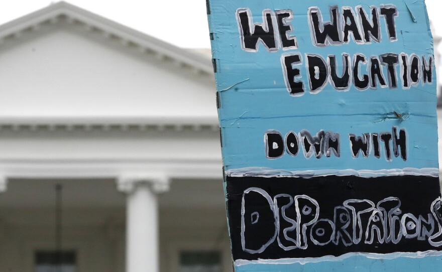 A sign is held up by the White House in support of the DREAMers and the Deferred Action for Childhood Arrivals (DACA) program, on Sept. 5, when Attorney General Jeff Sessions announced the Trump administration will "wind down" DACA.