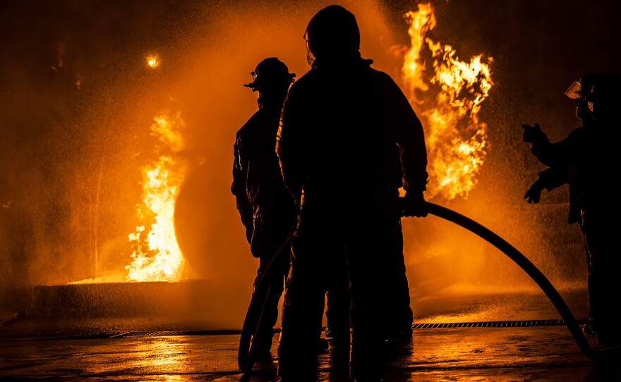 Firefighters are often exposed to carcinogens in the course of their work. Laws in many states say if they get cancer, it should be presumed to be linked to their work.