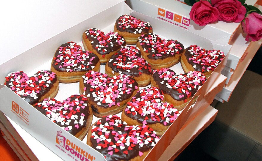 Police officers in Trenton, N.J., won't have to wait until Valentine's Day to feel the love from Dunkin' Donuts. The company is buying the building where the local paper The Trentonian is headquartered.