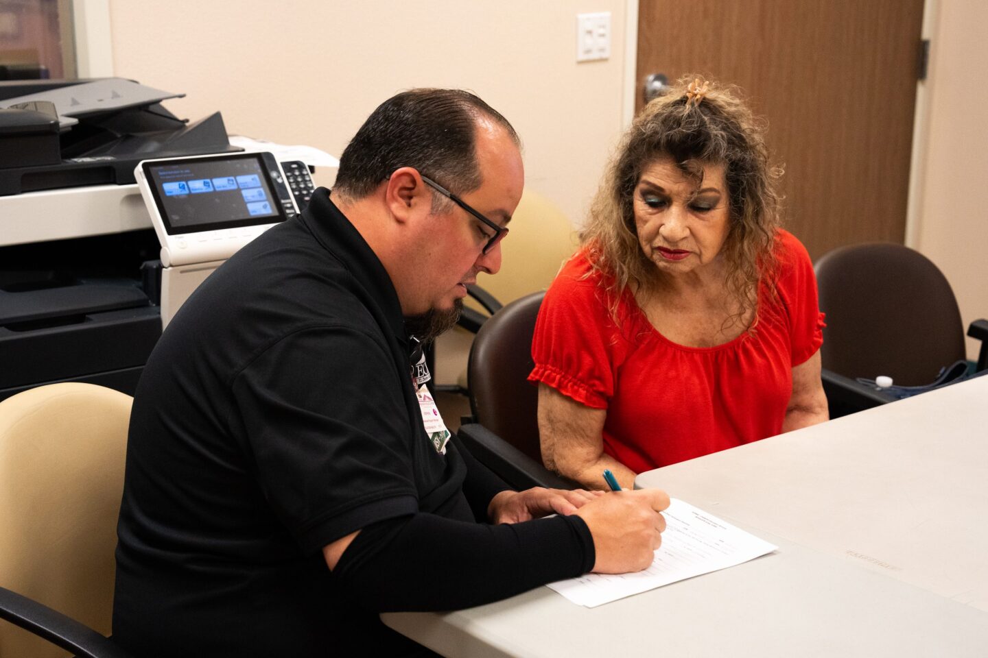 Stephen Jaime signs a form certifying that a patient completed the diabetes education class at El Centro Regional Medical Center's Calexico campus on July 15, 2024.