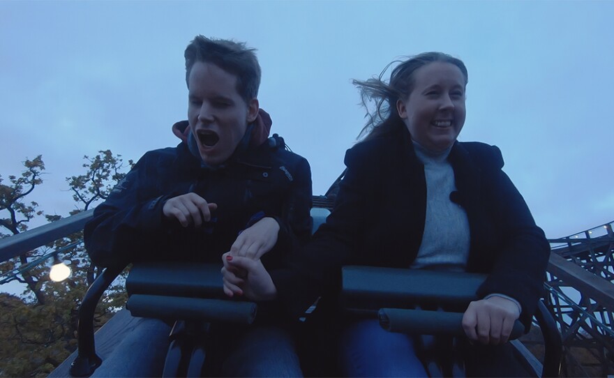 Christine (right) and her brother Peter ride a roller coaster in a scene from "He's My Brother."