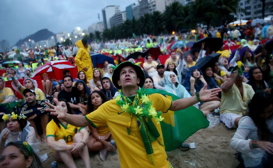 Brazil fans in Rio de Janeiro watch in horror as Germany routs the home team in the World Cup semifinal match played Tuesday.