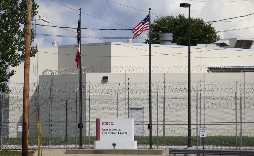 The main gate of the  privately-run Leavenworth Detention Center  in a 2016 file photo. At the time, the prison's operator was known as the Corrections Corporation of America but has since been renamed CoreCivic. Legal advocates are hoping the  facility shuts down when its federal contract ends at the end of the 2021.
