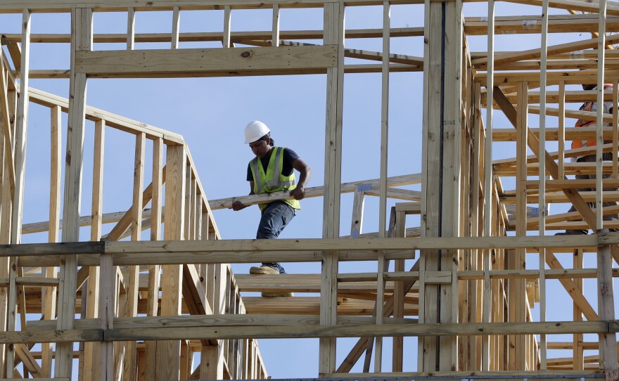 A construction worker at an apartment and retail complex in Nashville. The U.S. economy grew at a less-than-expected 2.6 percent pace in the fourth quarter.