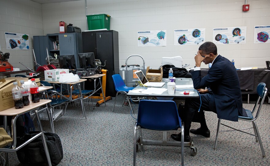 <em></em>Obama sits alone in a classroom on Dec. 16, 2012, before speaking at the memorial service for victims of the Sandy Hook Elementary School shooting<em>.</em>