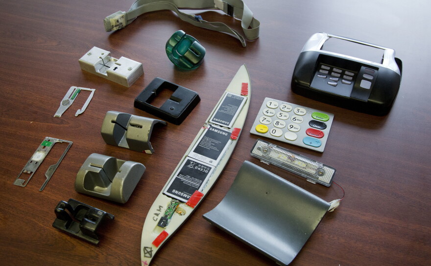 A variety of tools used to skim information from credit cards are displayed at the office of the New York Police Department's Financial Crimes Task Force. Over the years, the Justice Department has prosecuted individuals in SNAP skimming schemes, especially from Romanian crime rings.