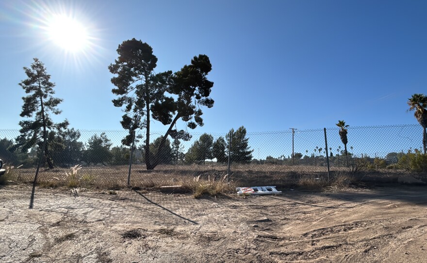 The lot at Sweetwater Road and Troy Street is currently vacant. Cars are parked near the fence on Oct. 28, 2025.