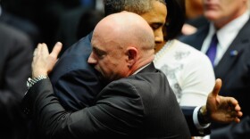 President Barack Obama hugs NASA astronaut Mark Kelly, husband of Rep. Gabrielle Giffords (D-AZ), during a service in Tucson, Ariz., Wednesday.