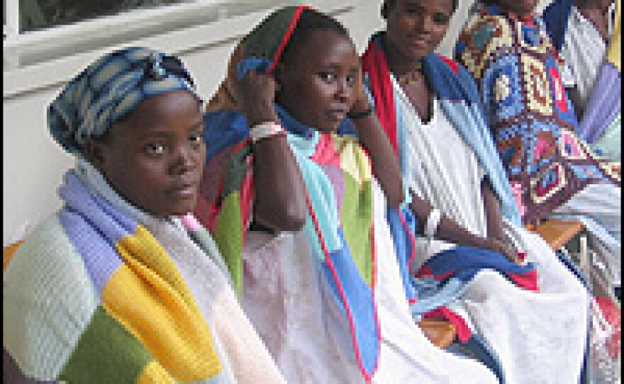Young girls sit on the veranda at the Addis Ababa Fistula Hospital in Ethiopia, wrapped in shawls that are given to them when they are admitted.