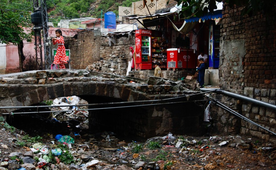 The river that once snaked through the village is now a large trash heap.