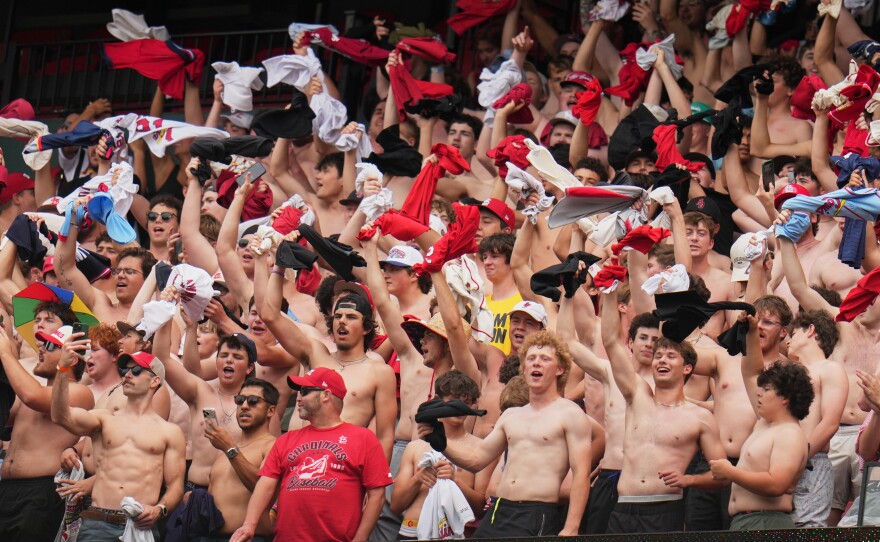 Fans cheer and wave their shirts above their heads during the fifth inning of a baseball game between the St. Louis Cardinals and the Kansas City Royals Saturday, May 16, 2026, in St. Louis.