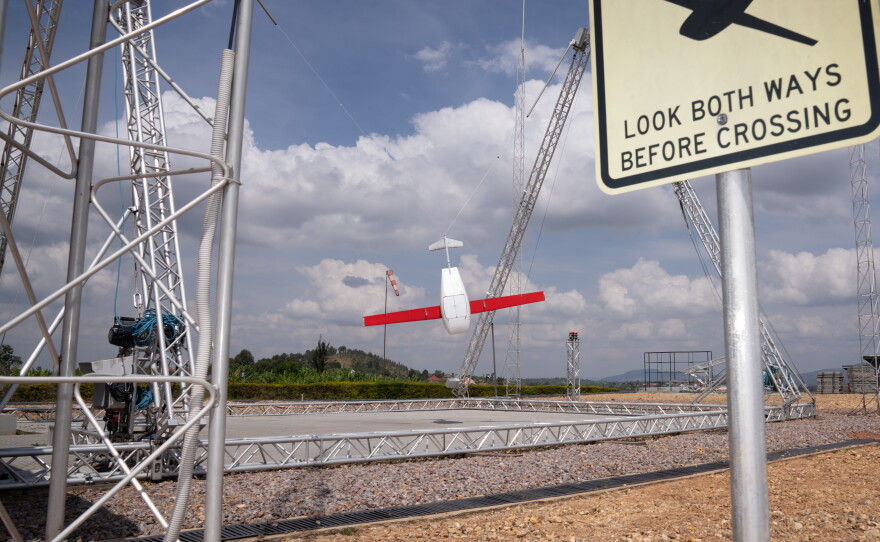 A drone, just returned from a delivery, swings into the landing mechanism in Muhanga, Rwanda. The country's government has contracted with American robotics company Zipline to deliver emergency blood through drones since 2016.