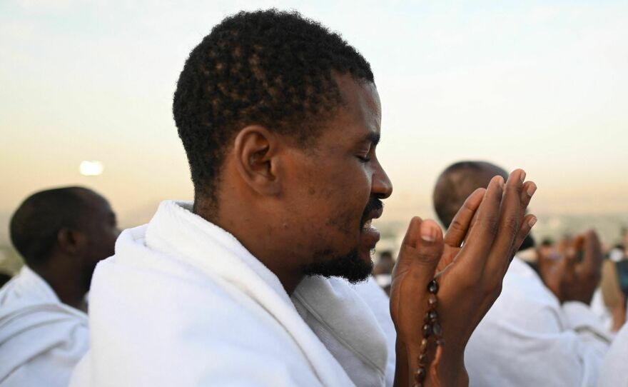 A Muslim pilgrim prays atop Saudi Arabia's Mount Arafat, also known as Jabal al-Rahma or Mount of Mercy, during the climax of the Hajj pilgrimage on Tuesday.