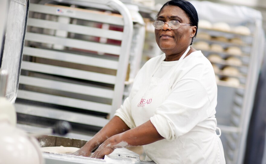 Hot Bread Kitchen graduate and product coordinator Marie Poisson divides focaccia dough.