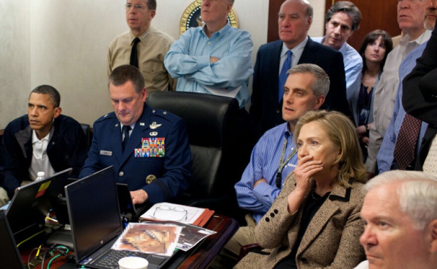 President Obama, Vice President Joe Biden and members of his National Security team receive an update on the mission against Osama bin Laden in the Situation Room of the White House. A classified document seen in this photograph has been obscured.