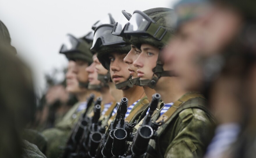 Russian troops and their Belarusian counterparts await orders during joint military exercises in Belarus last year. Next month, Russia will embark on another joint military exercise — this time on a much larger scale and in collaboration with China and Mongolia.