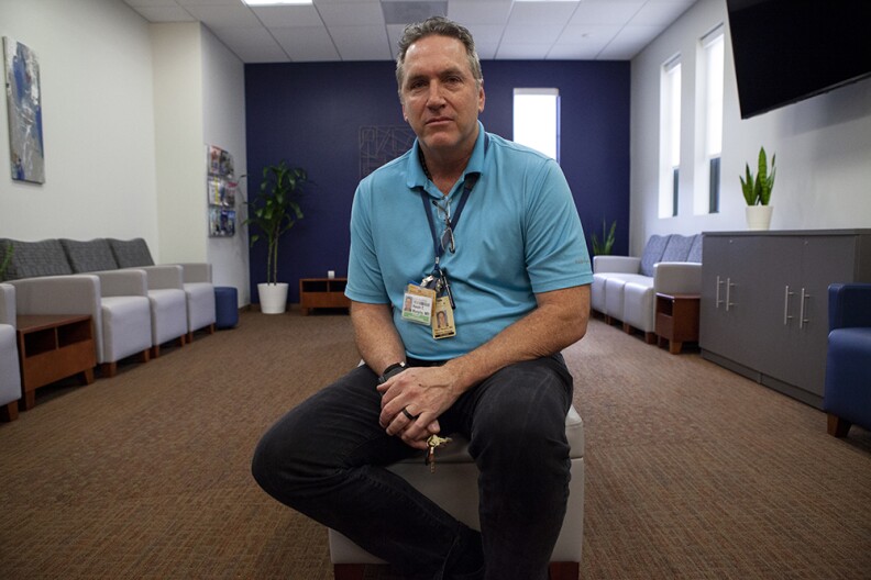 Dr. Kevin Murphy sits for a portrait inside the waiting room of the UCSD Center for Neuromodulation on Dec. 6, 2019.