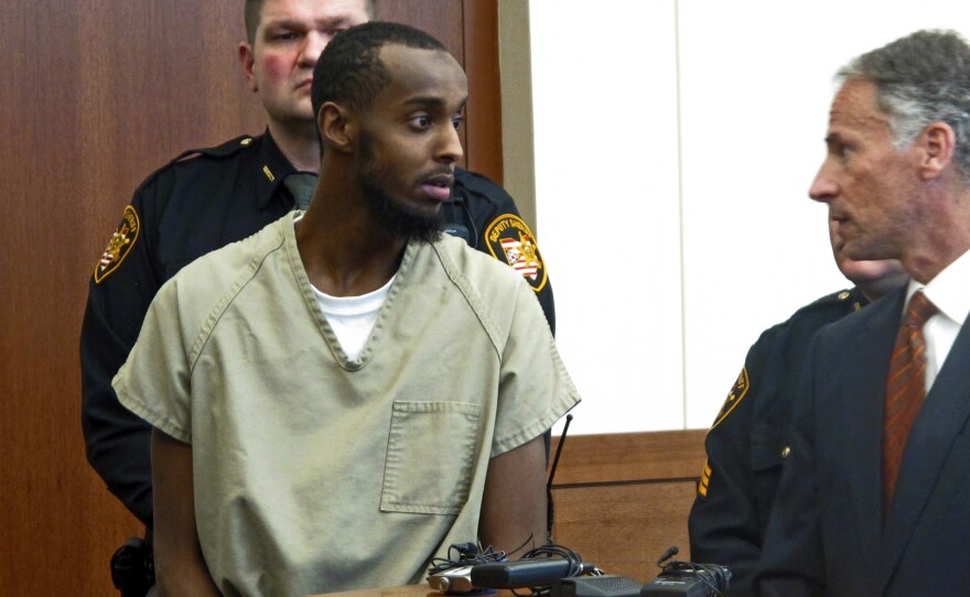 Abdirahman Sheik Mohamud is shown in a Columbus, Ohio, courtroom in 2015. He was arrested after traveling to Syria, then returning to Ohio, where he planned to carry out an attack. According to a new report, he's one of 12 Americans who went to join extremist groups in Syria or Iraq, and then returned back to the U.S. Mohamud was sentenced last month to 22 years in prison.
